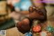 A woman's feet in black stockings sitting on a table with poker chips.