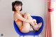 A woman in an orange bikini sitting on a blue chair.